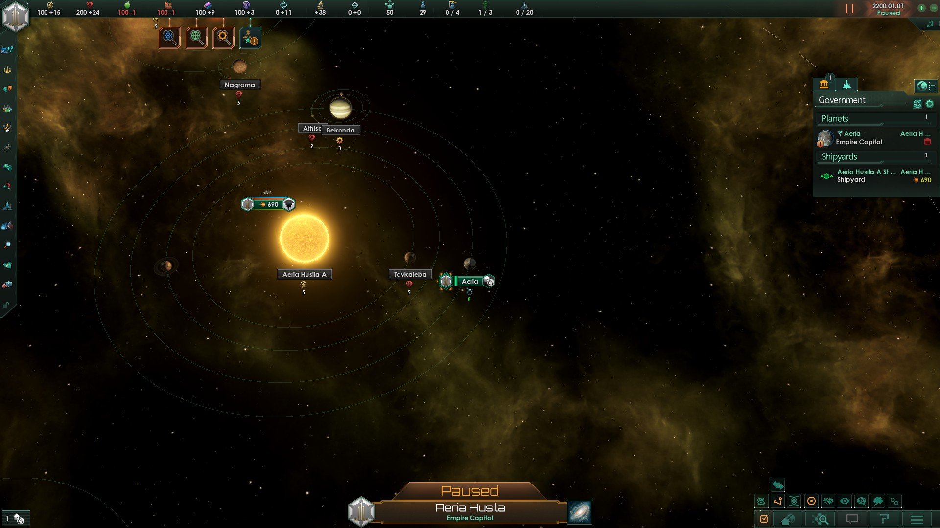 A screenshot of the main game screen. At the top is an info bar with the current amount of a number of resources, ranging from energy over alloys to research, empire size and available fleet capacity. On the left is a menubar granting access to additional screens like government, traditions or diplomacy. On the right side of the screen is a docket with the list of planets and shipyards. The main viewport shows a star system with a yellow star and five planets, some of which have symbols for resources they provide under them. The star is orbited by a starbase.