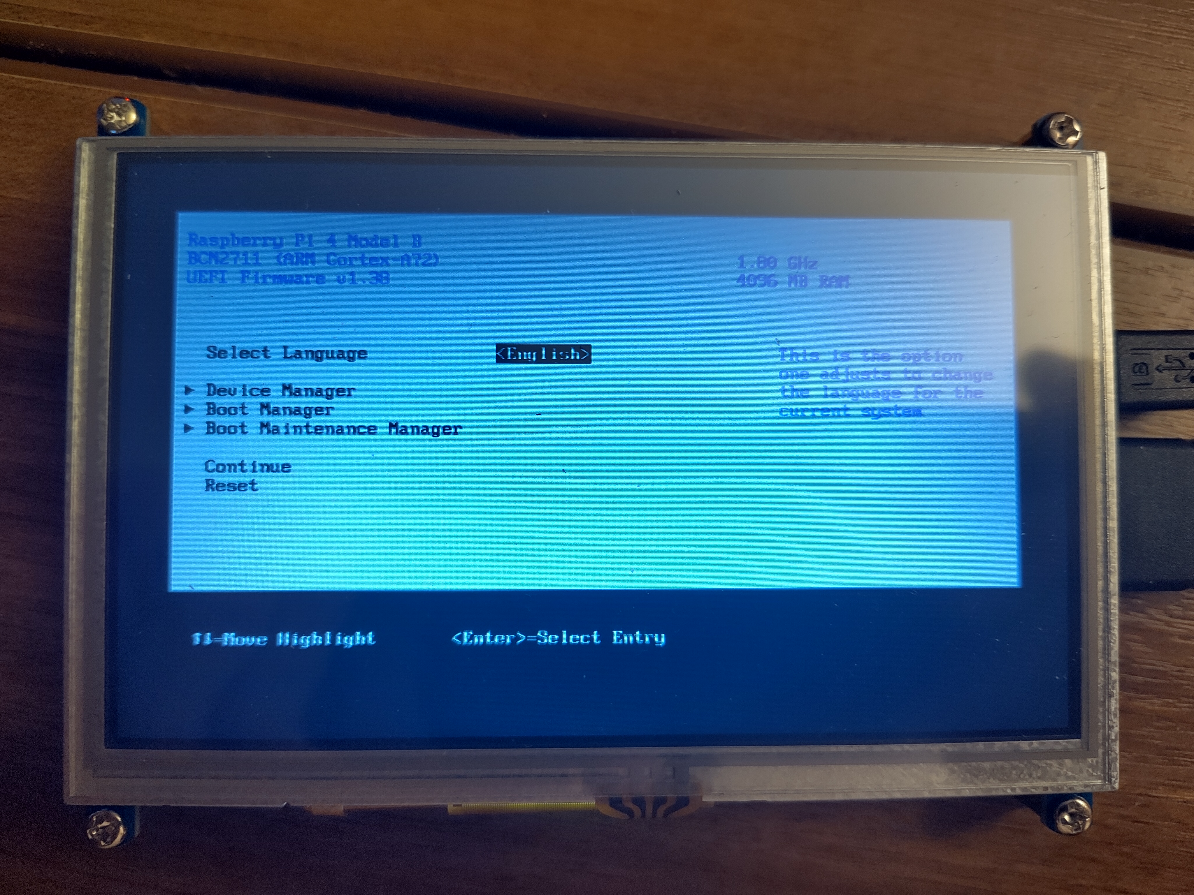 A picture of a screen showing the UEFI firmware config screen. Similar to an x86 UEFI menu, it shows information about the Pi like its CPU and RAM. Options include setting the language, and entering submenus for Device Manager, Boot Manager and Boot Maintenance Manager. It doesn't show any indication of why the UEFI menu is shown.